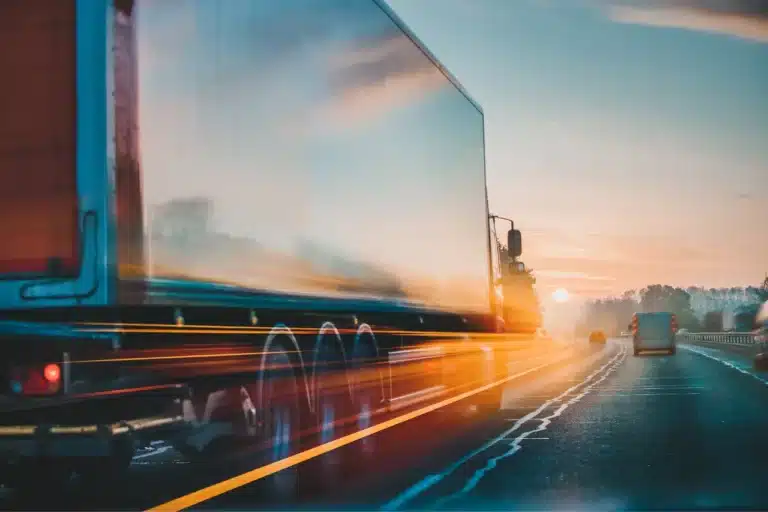 image of truck rolling down road